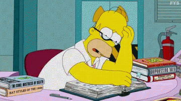Homer Simpson struggling to read a long book