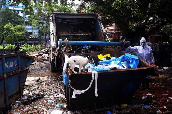 Open garbage bin where medical waste is disposed of